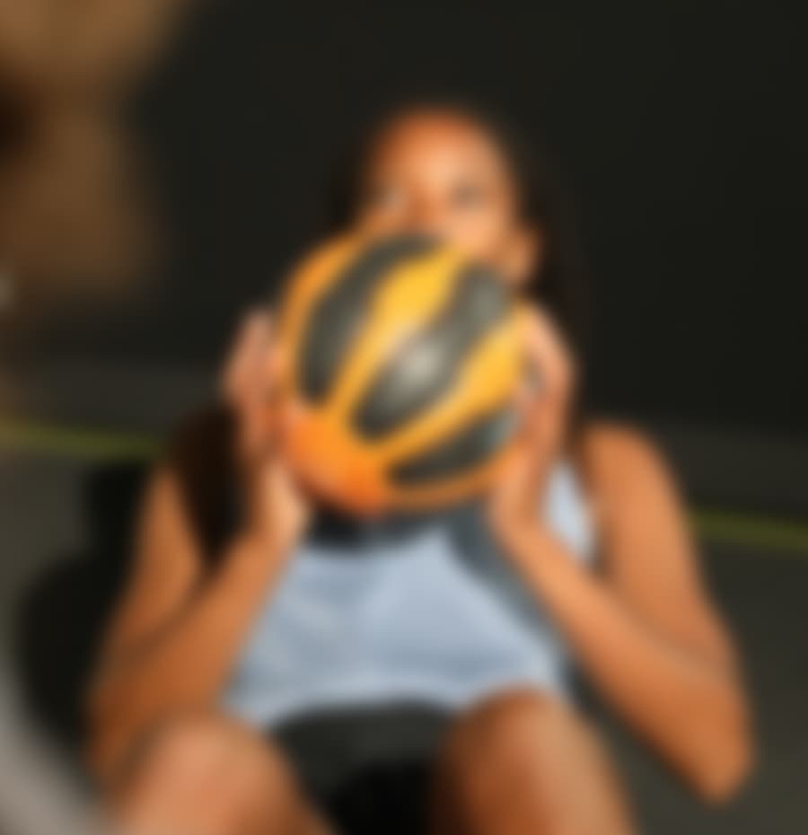 ProperForm program builder on a phone in a gym setting