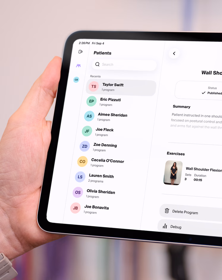 Clinician reviewing a patient list on a tablet