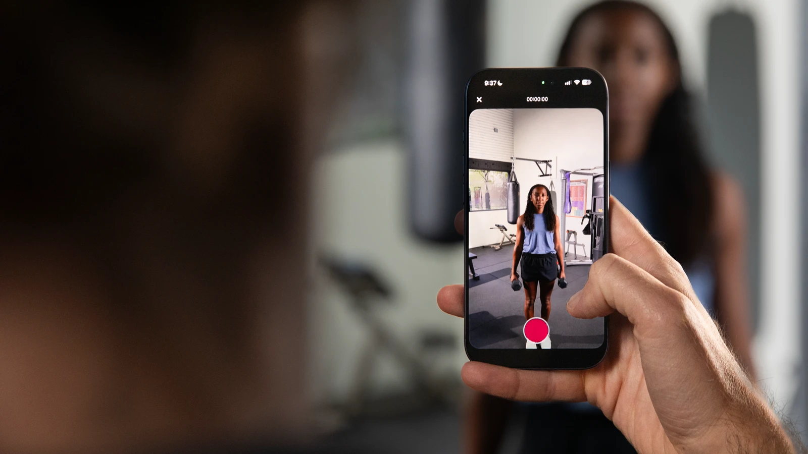Coach recording an athlete with the ProperForm app
